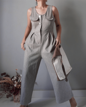 Ash romper with pockets, has one button missing at waist part