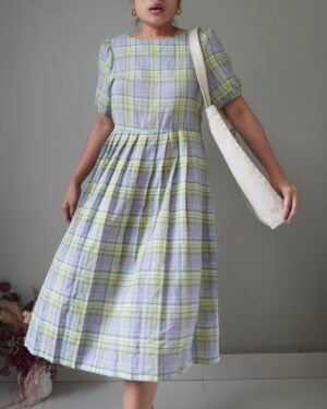 A beautiful pleated colorway country dress with a self tie ribbon