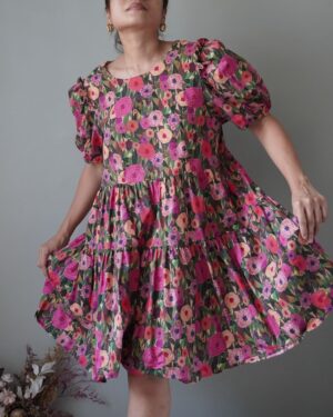 Ditsy patterned babydoll dress with puffed sleeves and tiered finish
