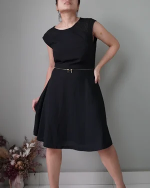 Chic little black sleeveless dress with minimal accents