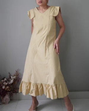 Butter linen dress with canopy sleeves and ruffle hem finish