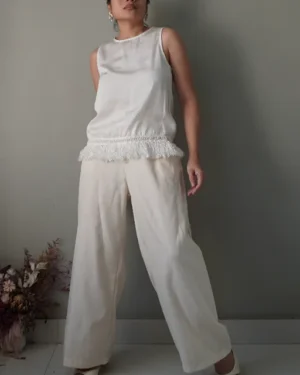 White silk sleeveless top with fringe details