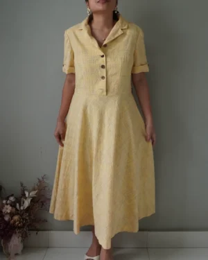 Yellow textured elegant vintage linen dress with buttons, one cracked button
